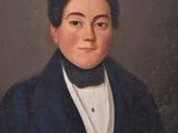 portrait of a young man in a blue coat and white shirt