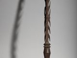 a tall wooden pole with a decorative design on it