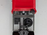 a toy train that is sitting on a white surface