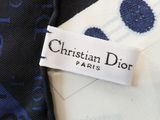 a close up of a christian dior label on a tie