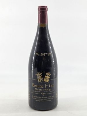 the bottle of wine is sitting on the table ready to be eaten