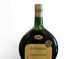 an image of a bottle of wine sitting on top of a white surface