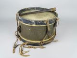 an old drum with a pair of drums on top of it