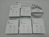four boxes of apple products are sitting on a white table