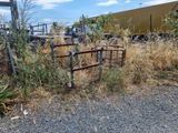 a fence that has a gate in the middle of it