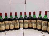 a group of bottles of wine sitting on top of a table