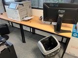 a computer monitor and printer on a desk in an office