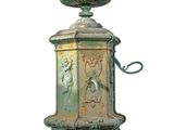 a green fountain with a bird on it on a white background