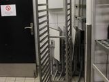 an image of a commercial kitchen with a rack of food