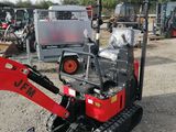 an image of a small excavator parked in a lot