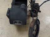 a small motorcycle with a side car attached to it