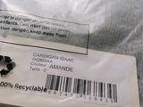 a plastic bag with a label on it that says cardigan asac