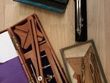 many different types of tools in a box on the table