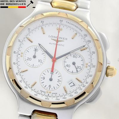 a close up of a wrist watch with a white dial