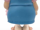 a small figurine of a little girl wearing a blue dress and pink shirt