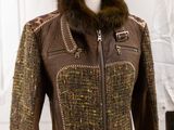 brown leather jacket with fur collar on mannequin display