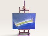 un petit chevalet sur lequel est accrochée une peinture représentant un surfeur