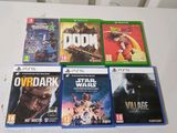 four video games on the table and one is for sale