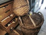 two wicker baskets sitting next to each other on the floor
