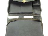 a black leather case with two compartments on the inside