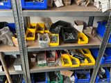 many different types of tools on the shelves in the garage