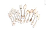 a lot of forks and spoons on a white surface