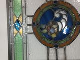 a picture of a stained glass window hanging on the wall
