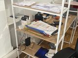 a desk with a chair and a computer on it