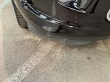 a close up of a car ' s front bumper