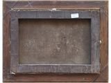 an old wooden picture frame with a tag on it