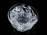 a clear glass bowl with a horse design on it