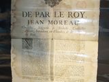 a piece of paper that is on display in a glass case