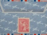 an envelope with a stamp on it with a picture of a woman and a plane