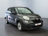 the small black car is parked in a large room
