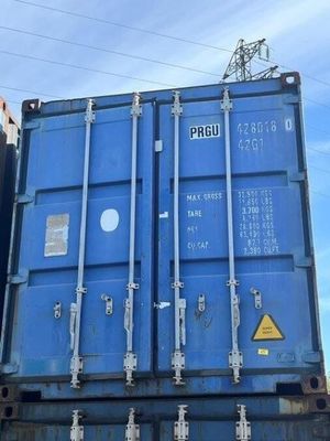 a blue container sitting on the back of a truck