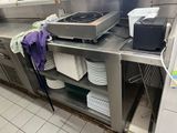 many plates and pans on the counter in the kitchen