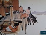 a picture of a painting of a man sitting at a table