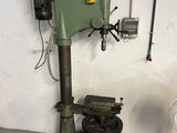a machine that is sitting on a wooden stand