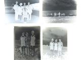 four black and white photographs of people standing on a beach