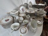 a table that has a lot of plates and bowls on it