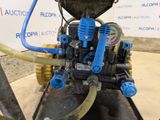 a blue hose connected to a blue valve on a pipe