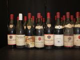 many bottles of wine lined up on a shelf