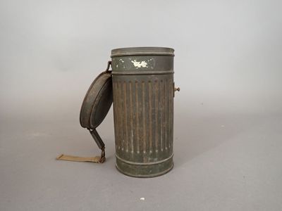 a metal trash can with a handle on it
