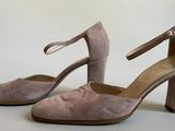 a pair of women ' s shoes on a white background