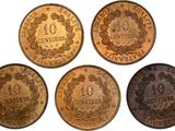 four different types of coins are shown on a white background