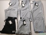 a group of men ' s pants and pants with tags on them