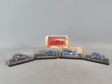 three toy cars are sitting on top of each other on a table