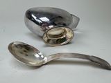 a spoon and a spoon rest on a table