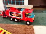 a toy fire truck that is sitting on the floor