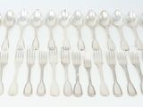 an image of a bunch of forks and spoons sitting on a table